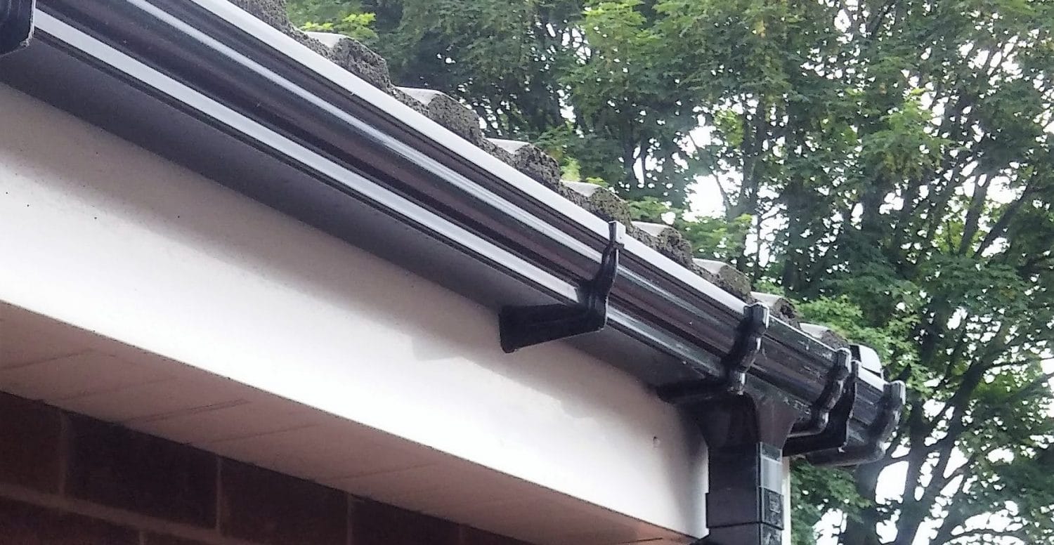 fascia boards and gutters with drainpipe